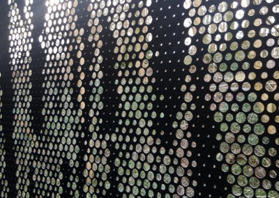 Habillage de façade en tôle aluminium anodise bronze - coulissant et porte -détail perfo